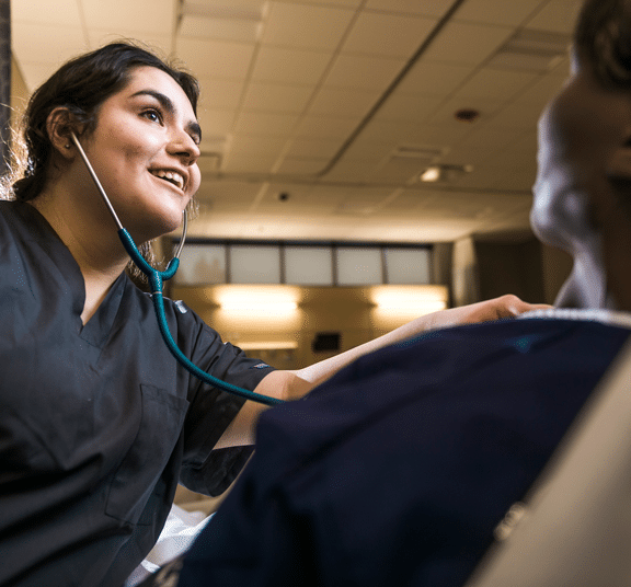 Female nursing student taking heart rate reading on a female mannequin in the De Witt Center for Nursing at Cornerstone University