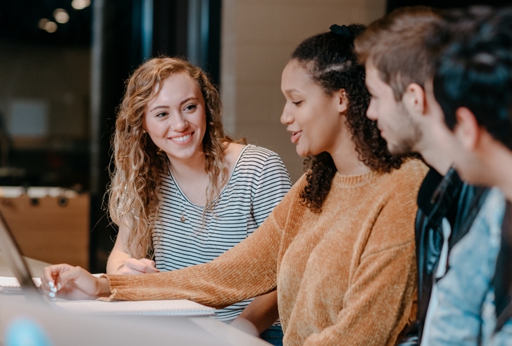 Male and female college students studying in the Corum Student Union at Cornerstone University