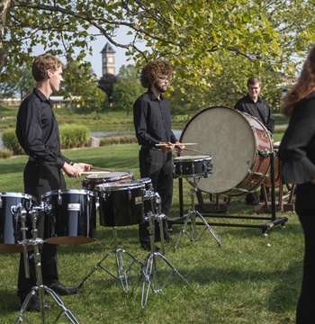 Percussion ensemble practicing outside on the campus of Cornerstone University