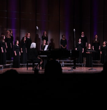Women's Chorus performing on stage in Matthews Performing Arts Center at Cornerstone University