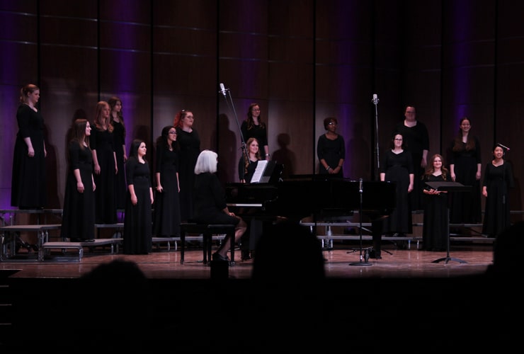 Women's Chorus performing on stage in Matthews Performing Arts Center at Cornerstone University