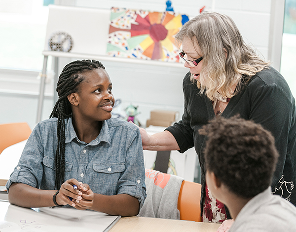 A Cornerstone University student teaches English as a second language (ESL) in a classroom setting.